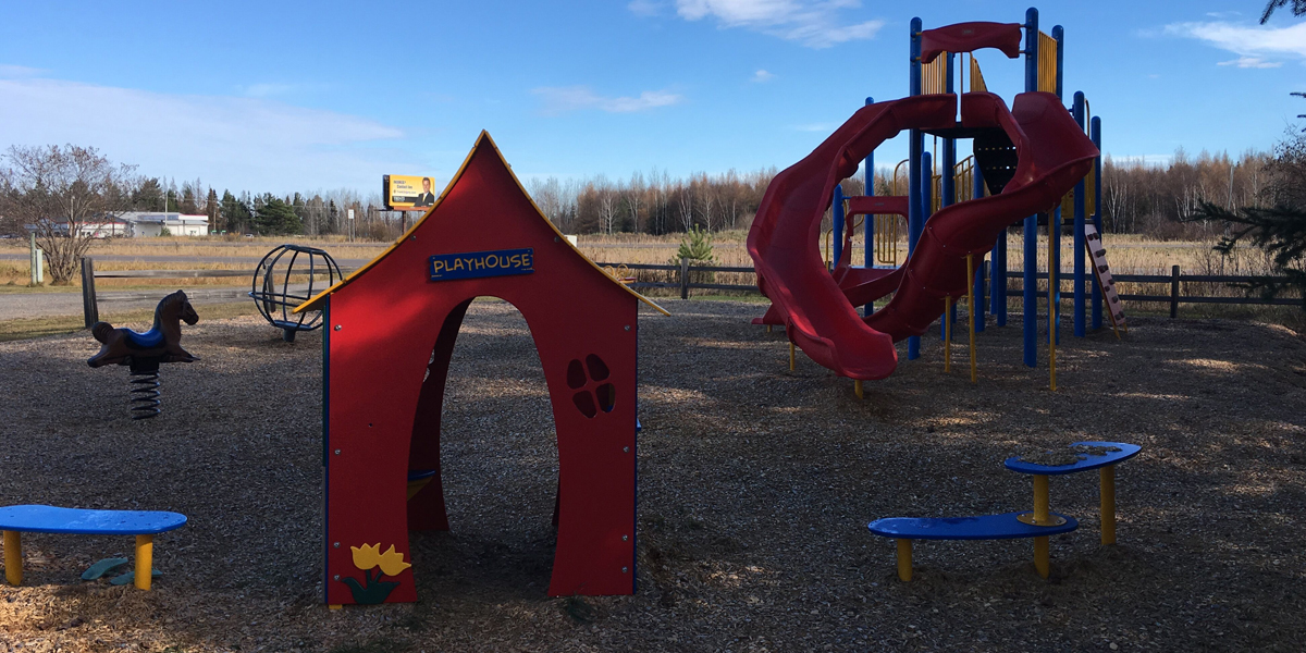 Red Schoolhouse Themed Playground