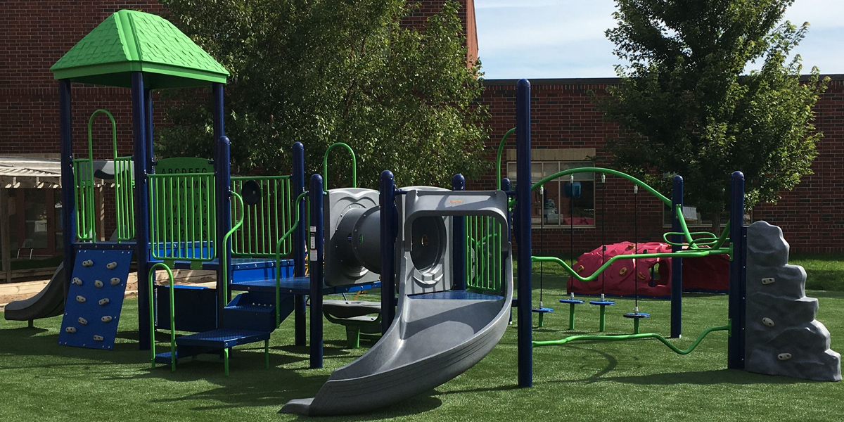 Playground at St. Ambrose School in Woodbury, MN Featuring Artificial Grass Turf