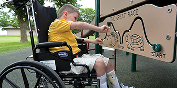 Child in Wheelchair at Playground