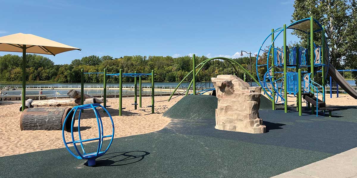 Nature Playground using climbing rock and log tunnels