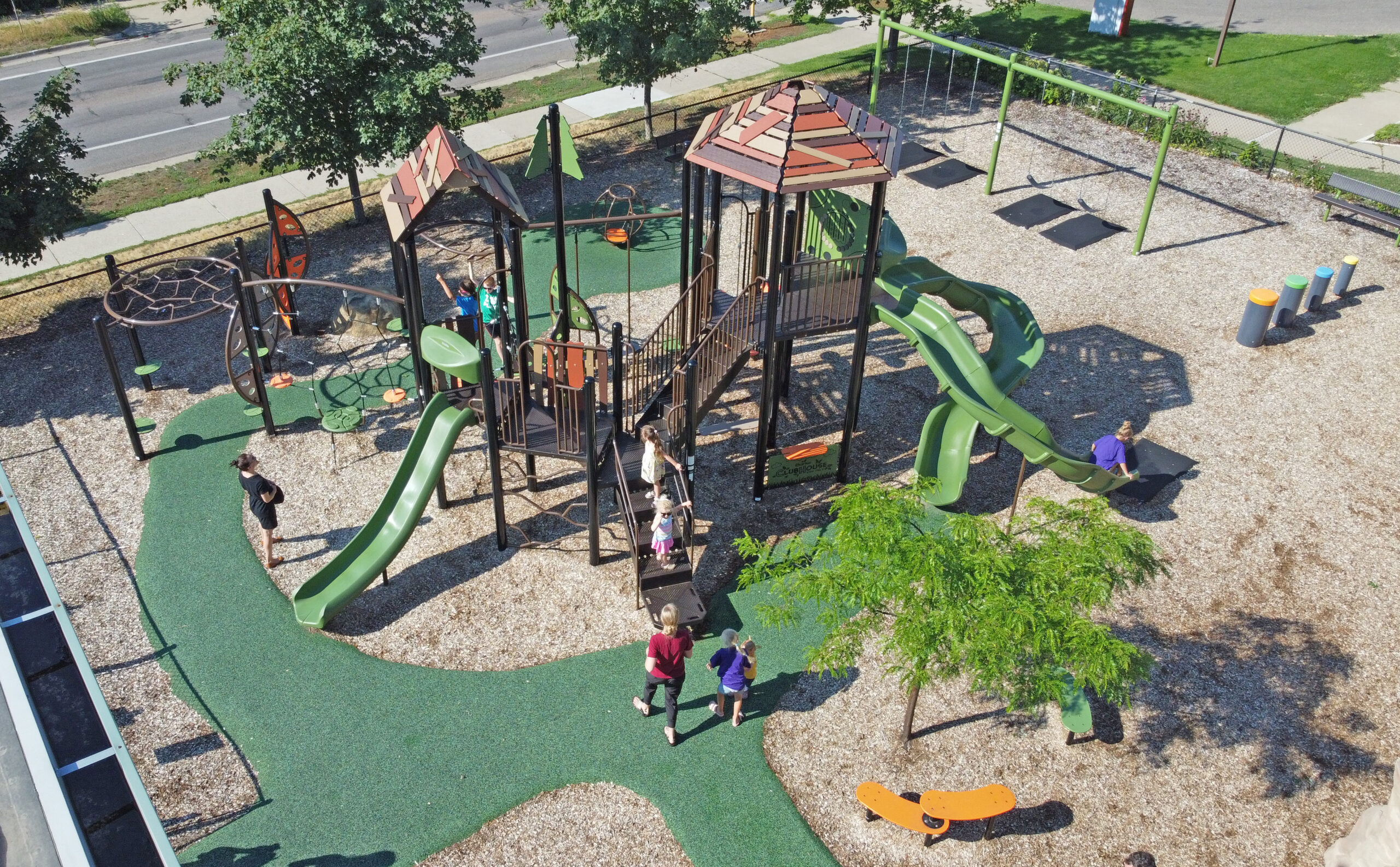 School playground at Hope Academy in Minneapolis, Minnesota with slides, climbing features, and safety surfacing