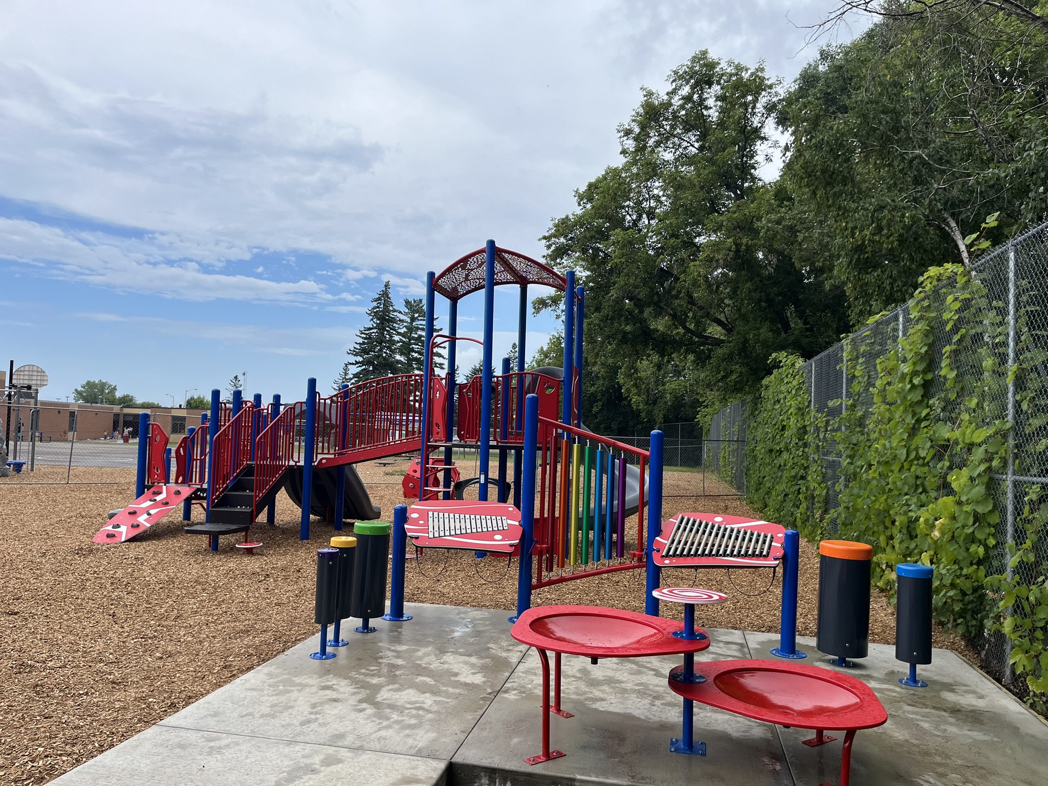 School playground at Riverside Elementary in Brainerd, Minnesota with classic play structures and accessibility features